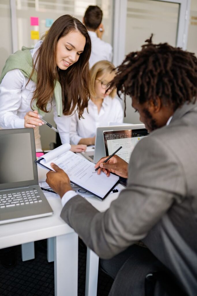 The Art of Drawing Readers In: Your attractive post title goes here Diverse team working together in an office, sharing ideas and technology for effective collaboration.