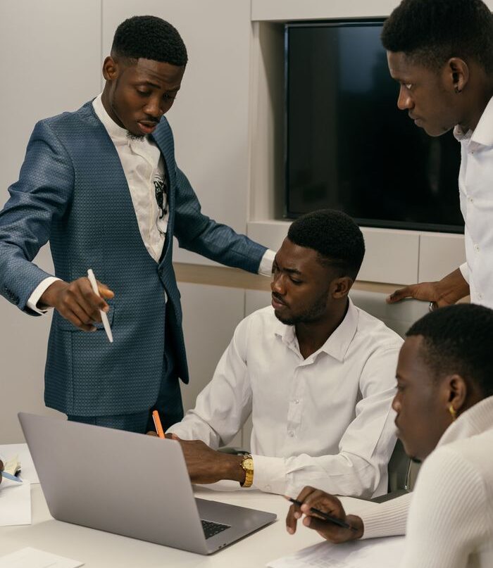 A diverse team engaged in a productive meeting in a modern office environment.